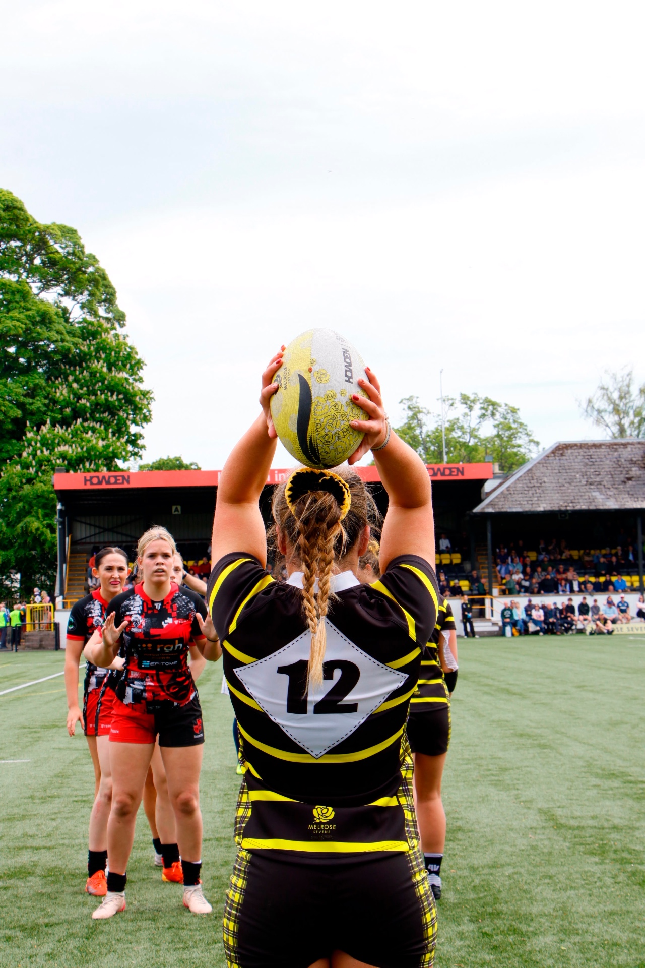 Rugby hooker preparing to throw into a line-out
